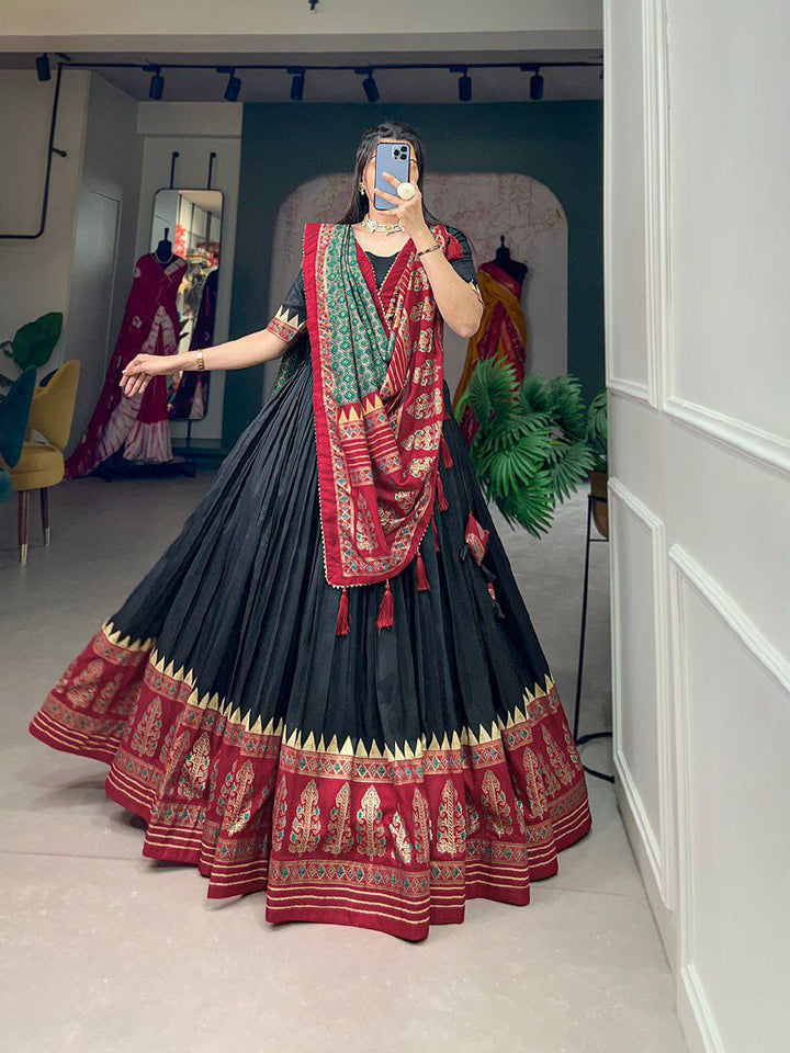 Artistry of Tussar silk and the mesmerizing allure of ikkat Patola prints with this exquisite lehenga cho ensemble.