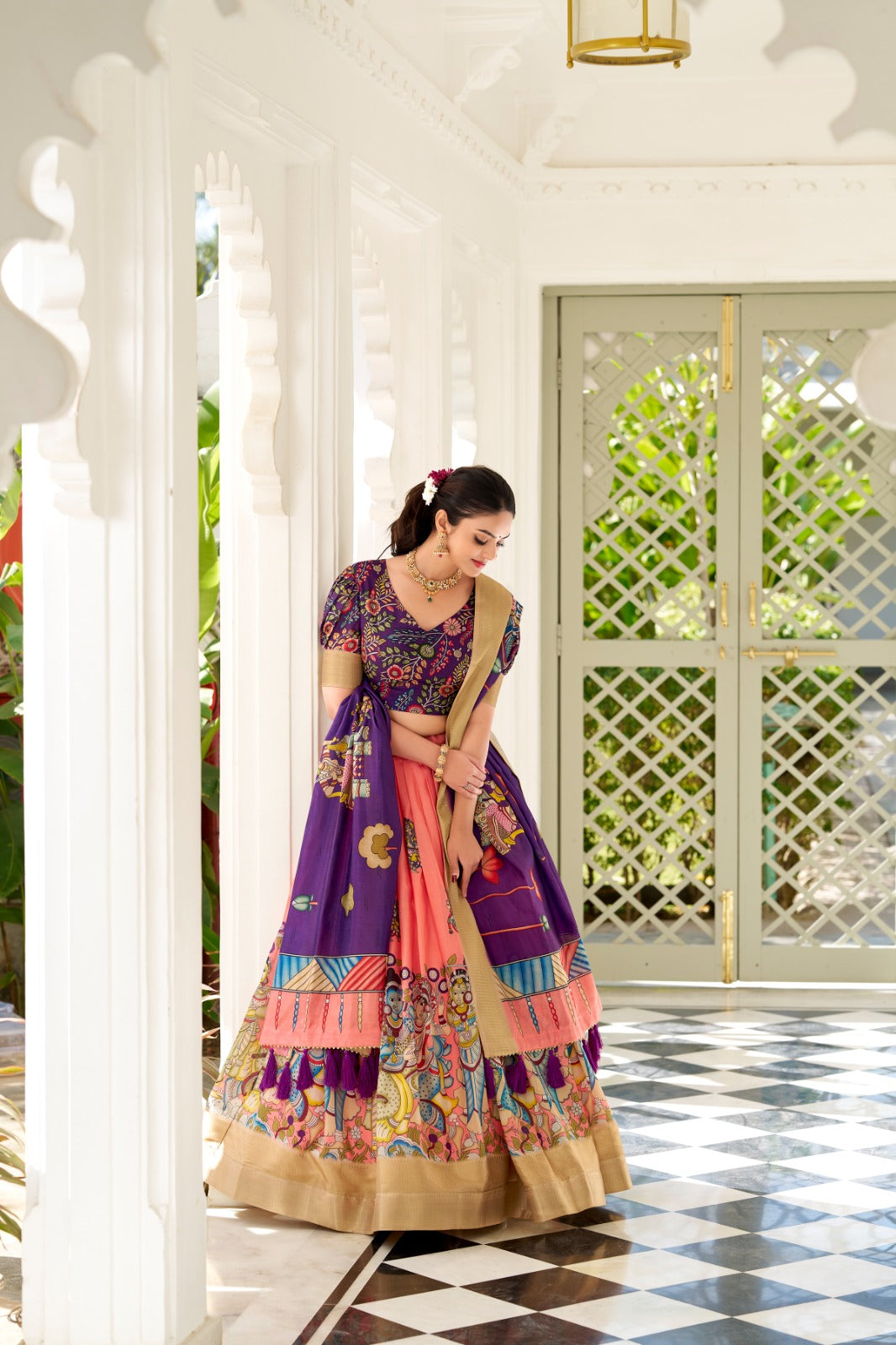 Dola Silk and the intricate charm of Kalamkari prints, the lehenga choli whispers tales of tradition and beauty